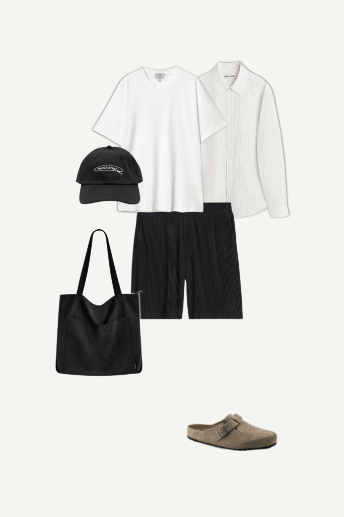 Casual spring outfit for men with cream-striped button-up shirt and black shorts