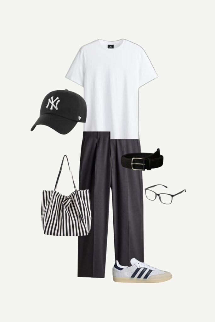 Men’s smart casual summer outfit featuring a white tee, relaxed-fit suit pants, Adidas Samba OG sneakers, Yankees cap, striped tote bag, woven belt, and eyeglasses.