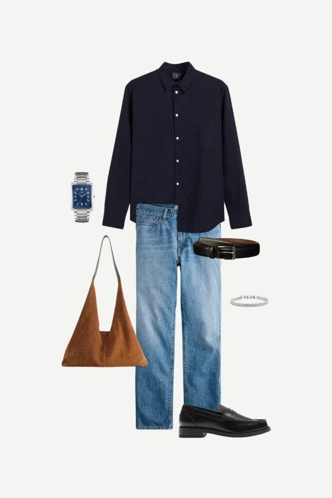 Smart casual summer outfit for men featuring a navy linen-blend button-up shirt, medium-wash jeans, black leather penny loafers, a brown suede shopping bag, black leather belt, silver quartz wristwatch, and a stainless steel bracelet—an elevated everyday look.