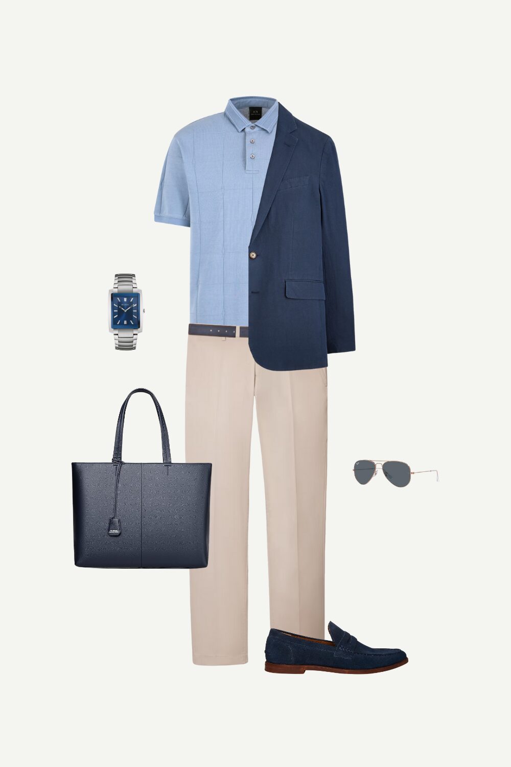 Flat lay of a business casual men’s summer outfit featuring a blue polo shirt, beige pants, navy suede loafers, and a navy leather tote bag.