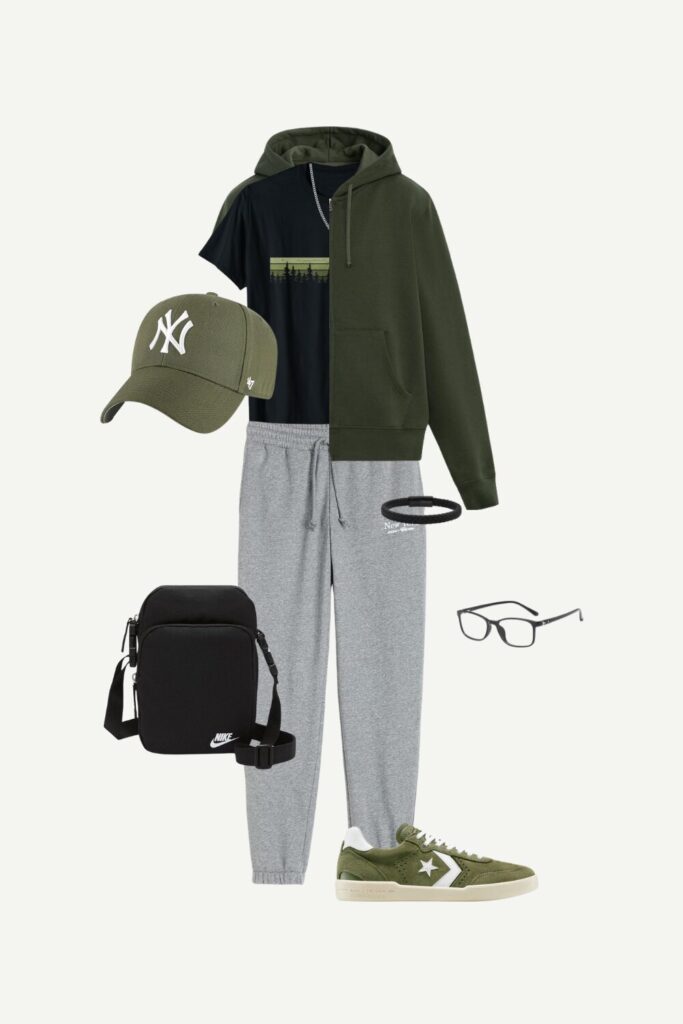 Flat lay of a men’s summer streetwear outfit featuring an olive green zip hoodie, black graphic tee, grey joggers, olive sneakers, cap, and accessories.