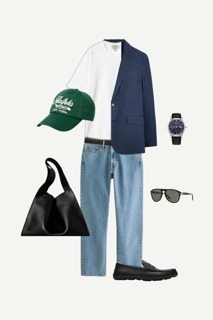 Men’s smart casual summer outfit featuring navy linen blazer, white cotton tee, vintage denim jeans, black driver loafers, and modern accessories.