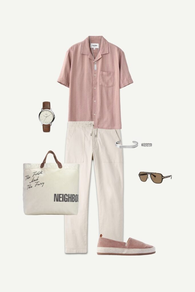 Men’s smart casual summer outfit with rose striped seersucker camp collar shirt, beige drawstring pants, espadrilles, and canvas tote bag