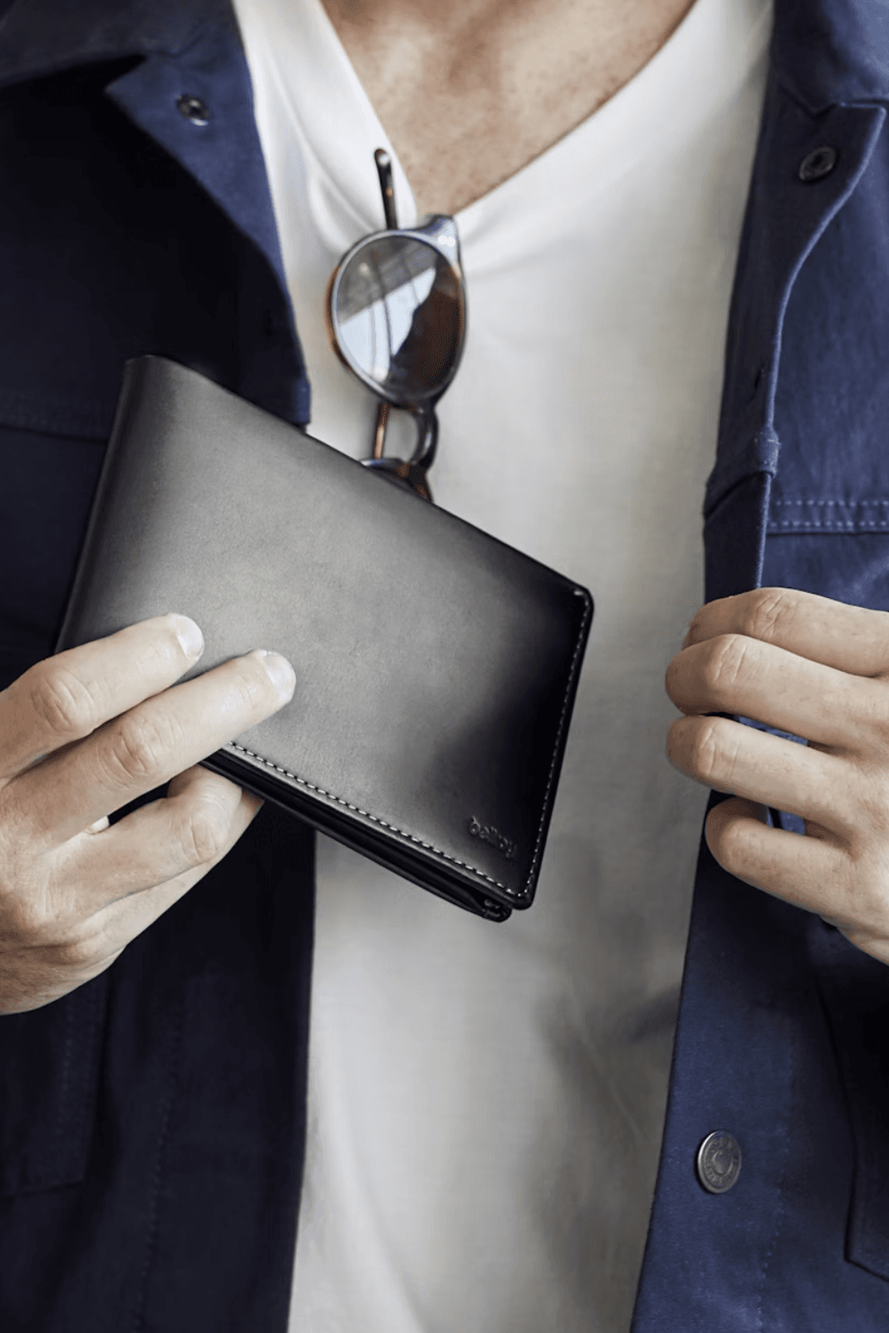 Black Bellroy Travel Wallet in hand