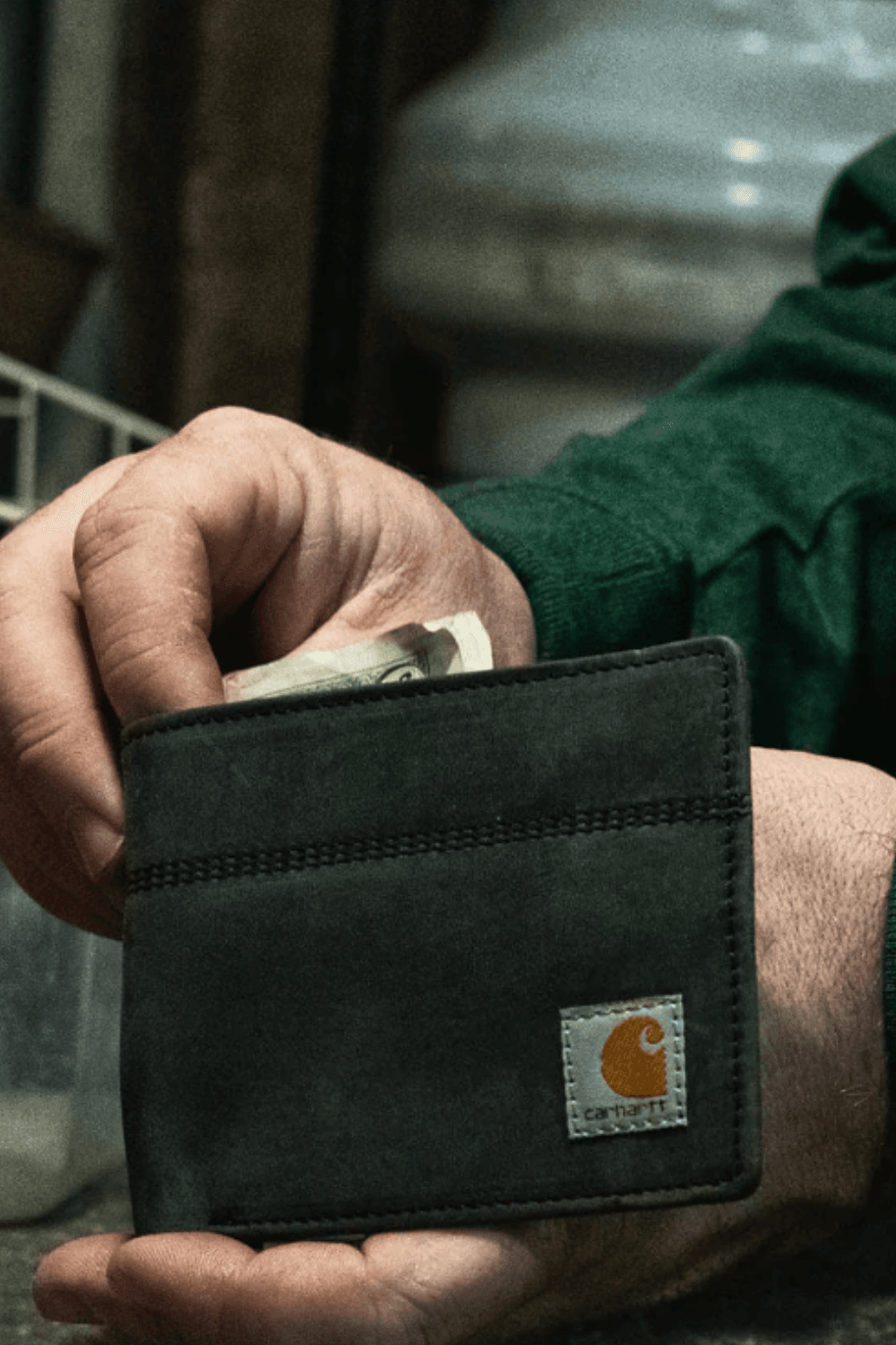 Black Carhartt Saddle Leather Bifold Wallet in hand